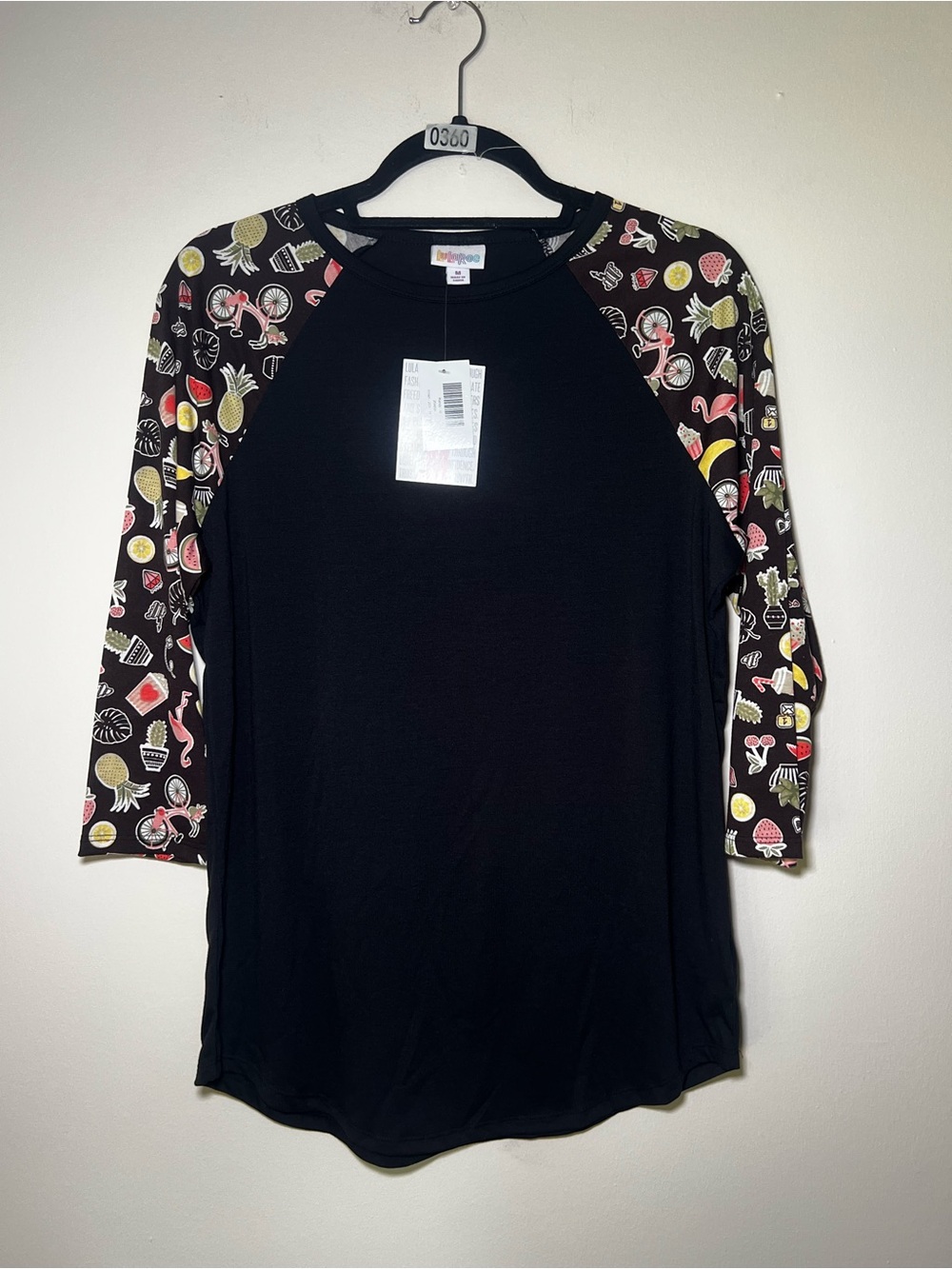 LuLaRoe Black Raglan Top with Summer Themed Patterned Sleeves